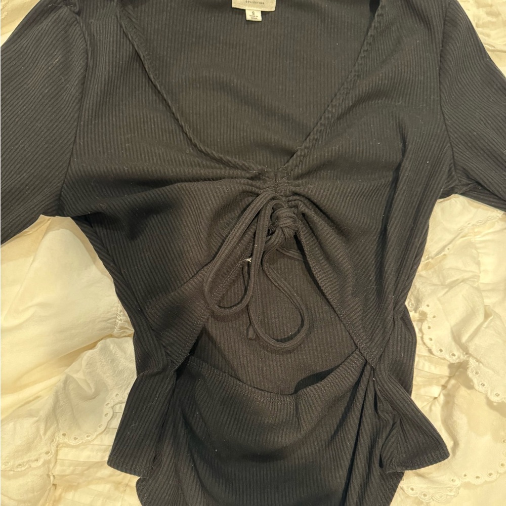 Black body suit with ties and cut outs